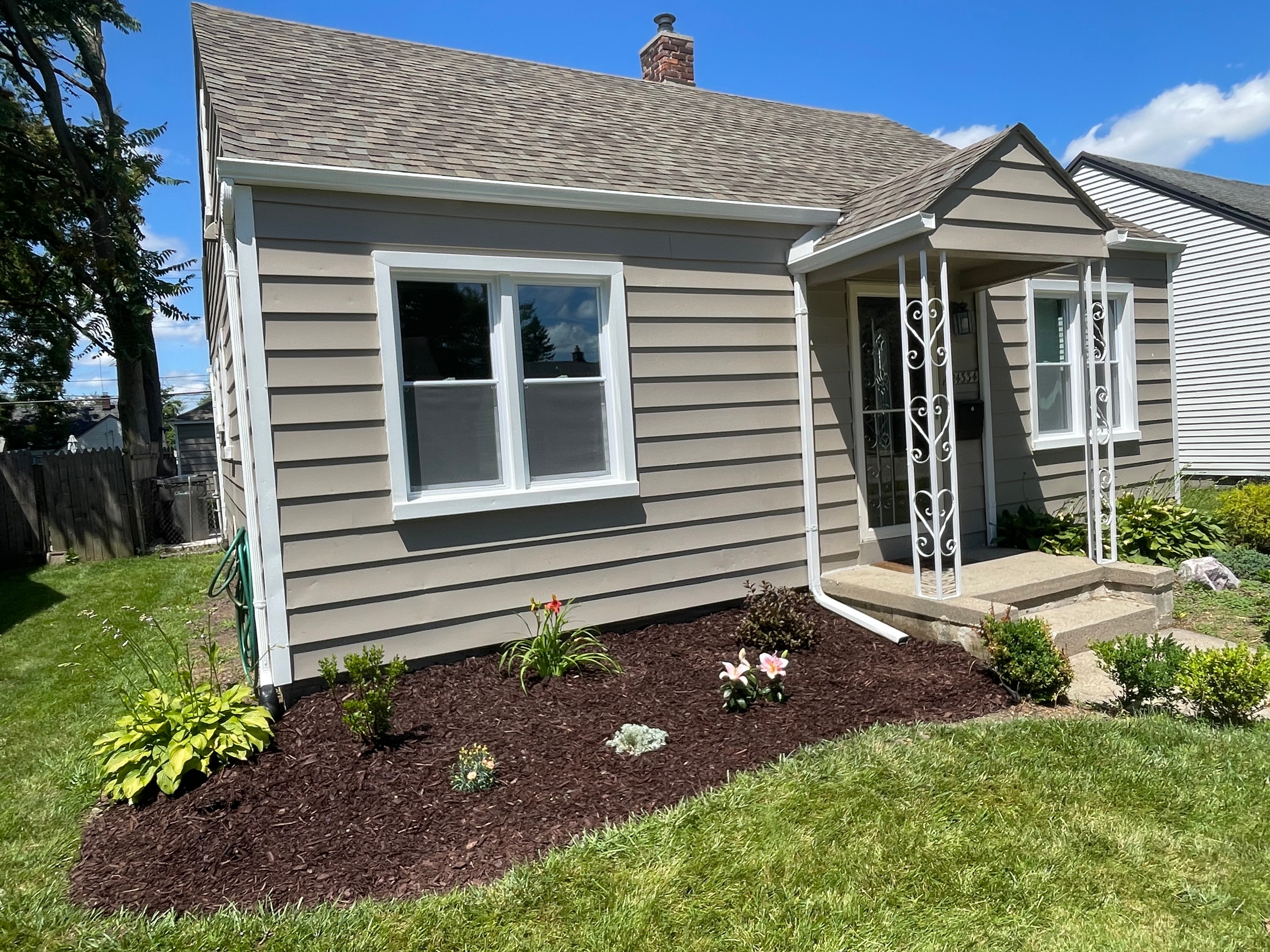 Renovated house with landscaped front yard